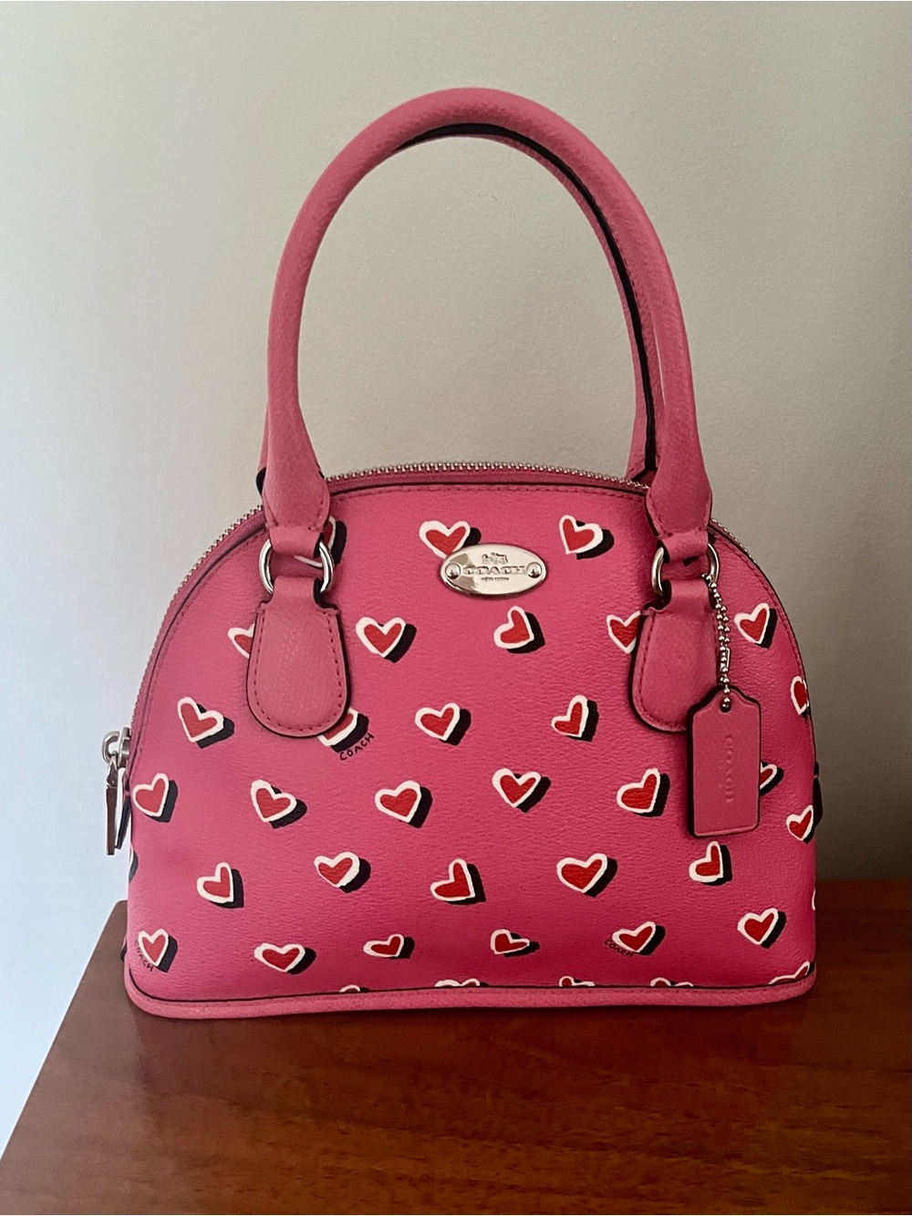 Coach pink heart print mini Cora dome purse